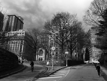 People walking on road in city