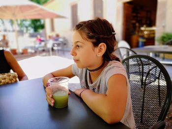 Girl having drink at restaurant