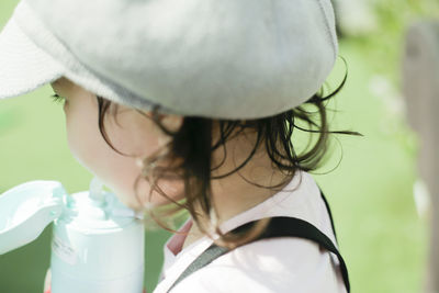 Close-up portrait of woman wearing hat