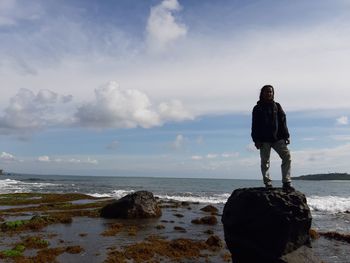 Man looking at sea against sky