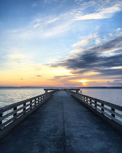 Scenic view of sea against sky at sunset