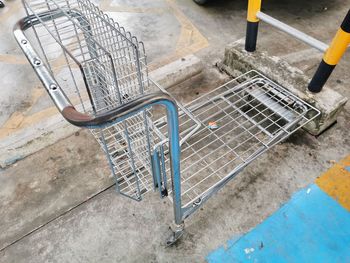 High angle view of bicycle parked on footpath