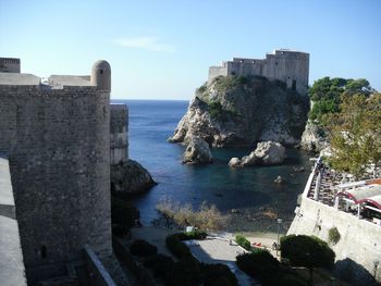 Panoramic view of sea and buildings against sky