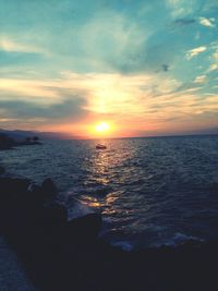 Scenic view of sea at sunset