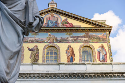 Low angle view of statue against building