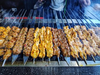 High angle view of meat on barbecue grill