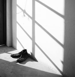 Low section of shoes on tiled floor