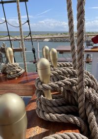 Close-up of rope tied to bollard