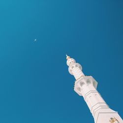 Low angle view of tower against clear blue sky