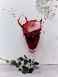 Close-up of red wine glass on table