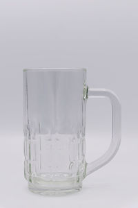 Close-up of glass of water against white background