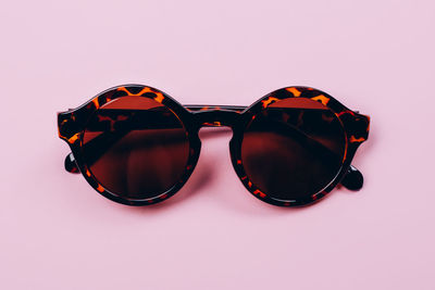 Close-up of sunglasses against black background