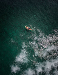 High angle view of people on sea. surfing 
