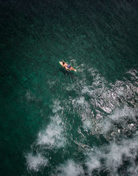 High angle view of people on sea