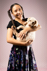 Portrait of smiling woman with dog