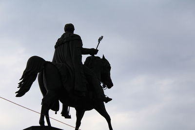 Low angle view of statue against sky