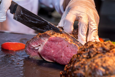 Close-up of man preparing food