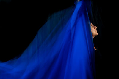 Time lapse view of woman moving a rag. long exposure, motion blur. 