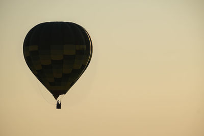 Low angle view of hot air balloon against clear sky