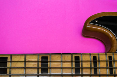 Low angle view of pink window on building