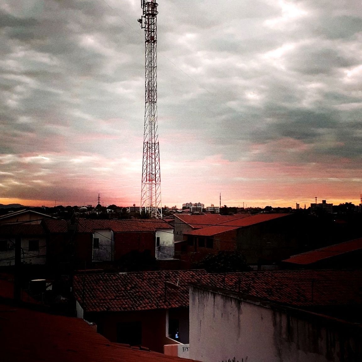 architecture, cloud - sky, built structure, sky, building exterior, sunset, nature, building, no people, city, roof, outdoors, technology, residential district, house, communication, connection, industry, dusk, dramatic sky, power supply