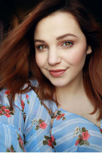 Portrait of beautiful young woman smiling at home