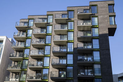 Low angle view of buildings against blue sky