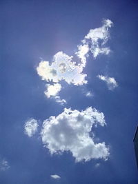 Low angle view of tower against blue sky