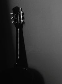 Close-up of electric lamp against wall