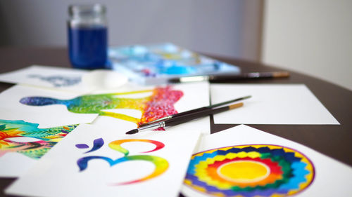 Close-up of multi colored paper on table