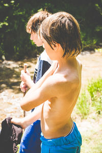 Side view of shirtless boy