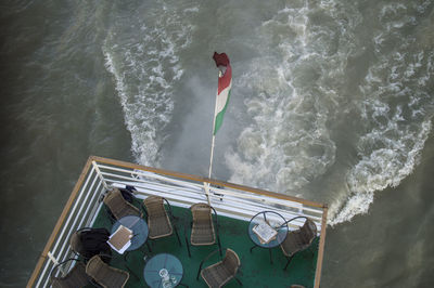 High angle view of hungarian flag on boat in sea