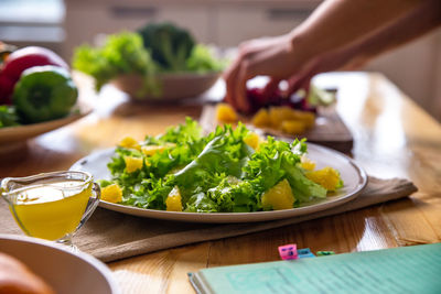 Caesar salad with copyspace on a wooden table on kitchen