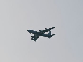 Low angle view of airplane against clear sky