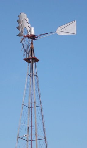 clear sky, low angle view, blue, fuel and power generation, copy space, technology, wind power, environmental conservation, alternative energy, windmill, day, wind turbine, electricity, renewable energy, outdoors, electricity pylon, no people, traditional windmill, sunlight, power line