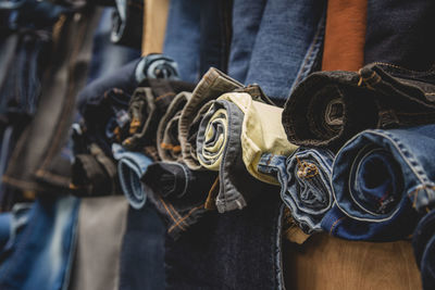 Close-up of clothes hanging on display at store