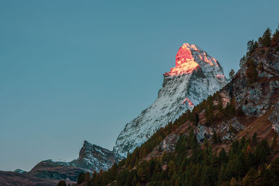 Mountain glow, matterhorn peak illuminated by the morning sun.