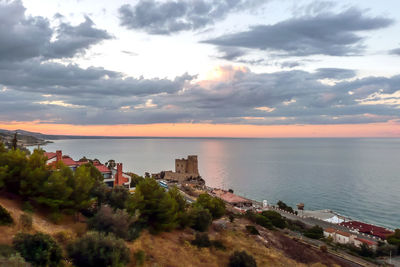 Aerial view of roseto capo spulico during a beautiful sunset over the sea