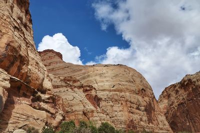 Low angle landscape of white rock mountains and boulders in utah