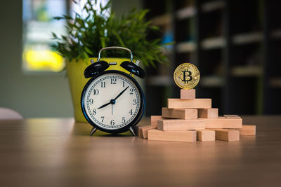 Close-up of clock on table