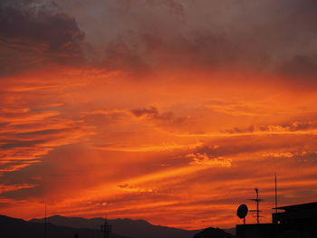 Low angle view of dramatic sky during sunset