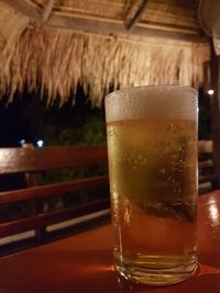 Close-up of beer glass on table