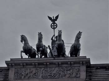 Low angle view of statue against sky