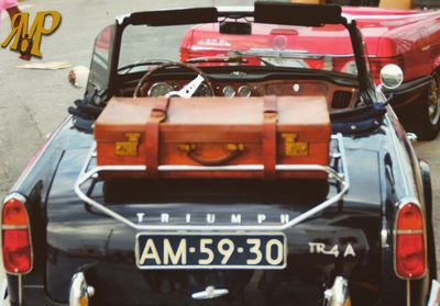 Close-up of vintage car on street