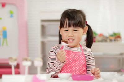 Portrait of cute girl at home