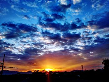 Scenic view of dramatic sky during sunset