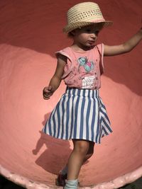 High angle view of young woman standing on beach