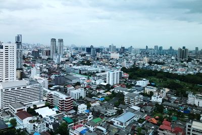 High angle view of buildings in city against sky