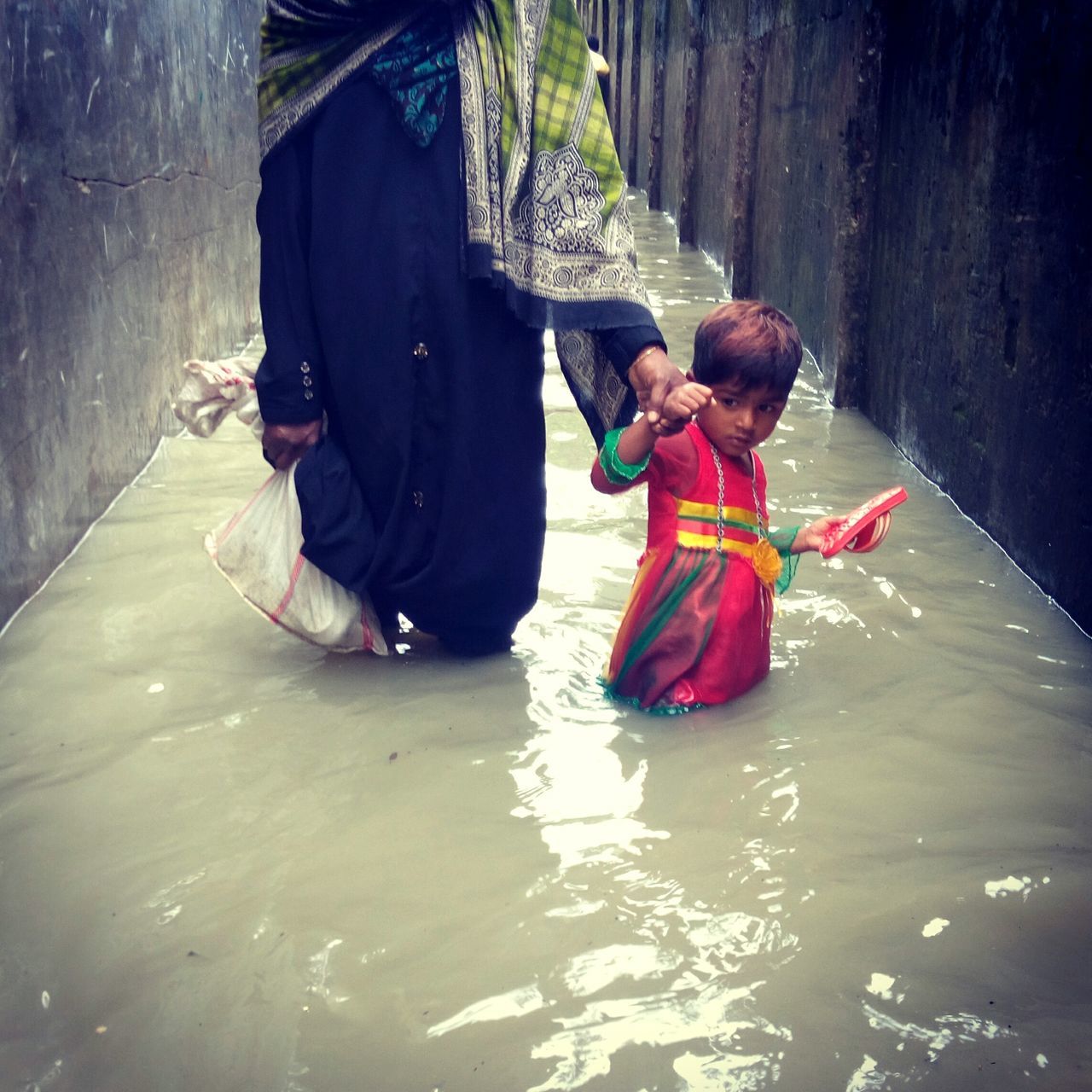 togetherness, mother, real people, love, childhood, family with one child, girls, full length, women, bonding, daughter, day, lifestyles, boys, outdoors, adult, people