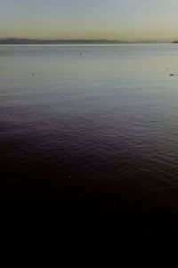 Scenic view of sea against sky at sunset